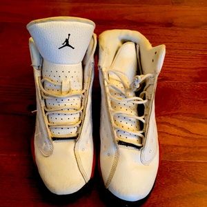 Red $ White Jordan basketball shoes.